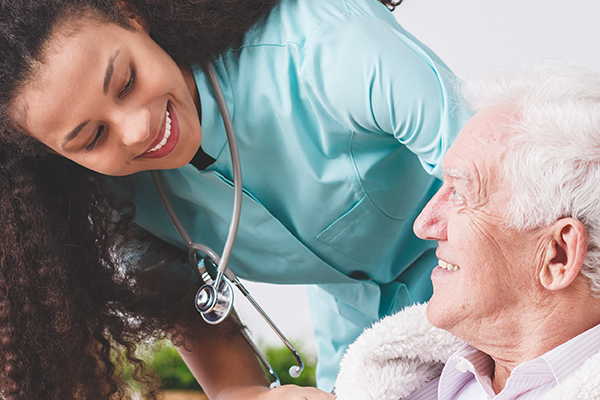 caretaker smiling at patient