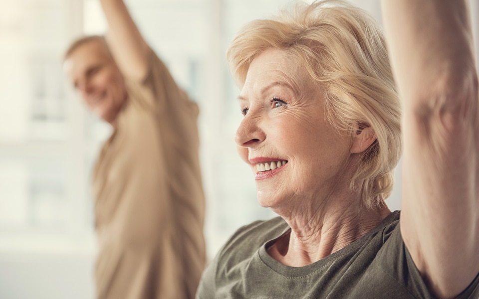 Woman smiling while stretching