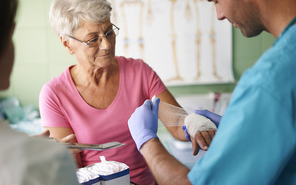 Patient getting their wound wrapped